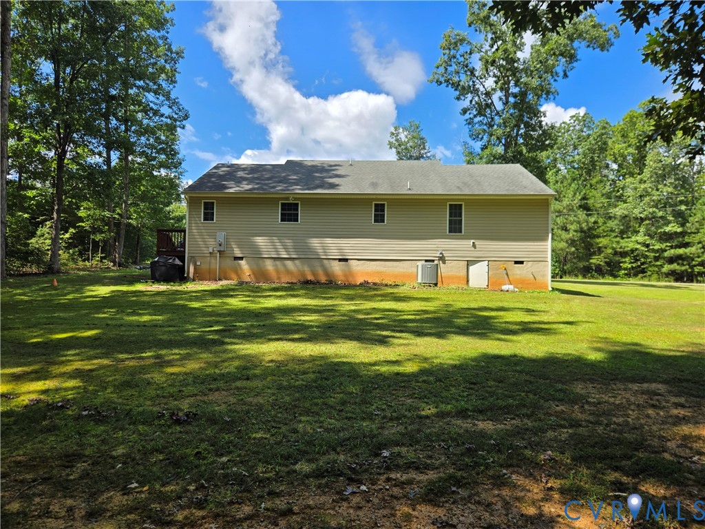 289 Winding Ridge Way Bumpass, VA 23024 - Photo 13 of 16 Expansive grassy yard with mature trees and a rear