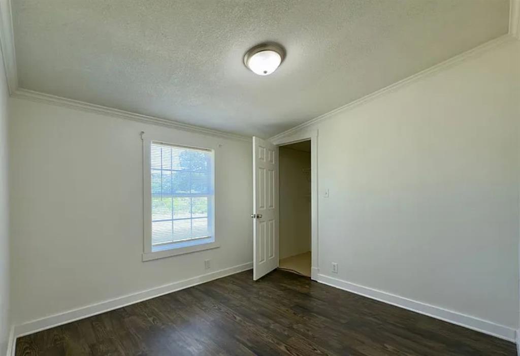 375 Alto Lane Gholson, TX 76705 - Photo 12 of 15 an empty room with wooden floor and windows