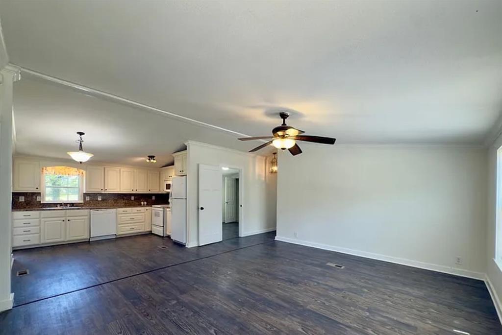 375 Alto Lane Gholson, TX 76705 - Photo 3 of 15 an open kitchen with a refrigerator and a stove top oven