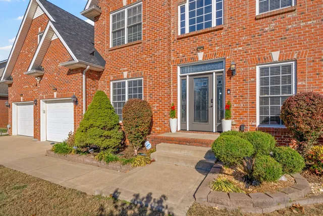 a front view of a house having outdoor seating