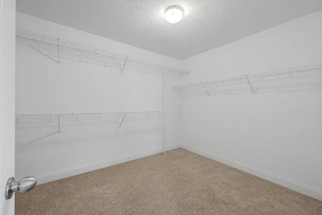 a view of a livingroom with furniture and a window