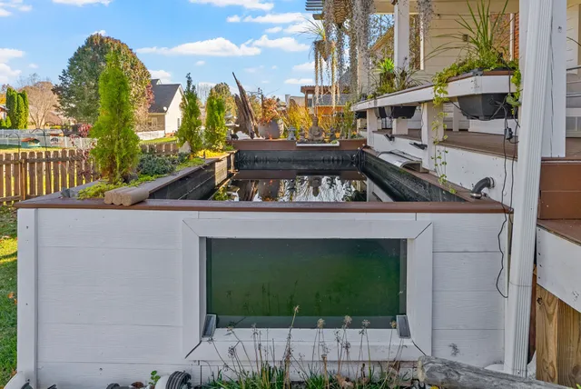 a view of a lake with houses in the background