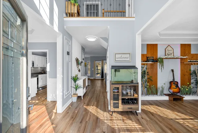 a view of a dining room with furniture window and wooden floor