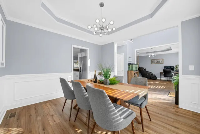 a view of a workspace with furniture and a potted plant