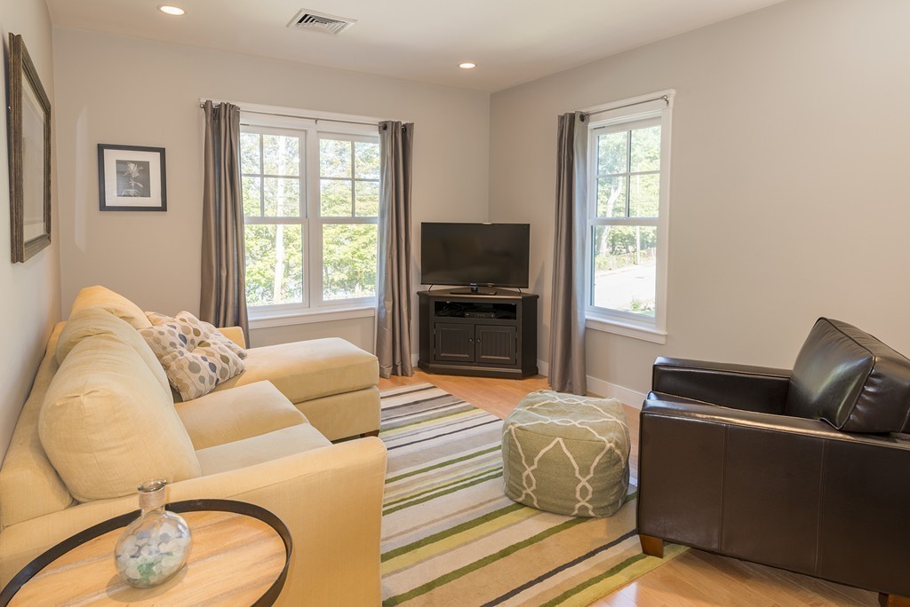 3 Turkey Shore Road Ipswich, MA 01938 - Photo 15 of 21 a living room with furniture a flat screen tv and a window