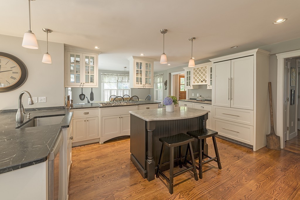 3 Turkey Shore Road Ipswich, MA 01938 - Photo 3 of 21 a kitchen with kitchen island a dining table chairs sink and cabinets