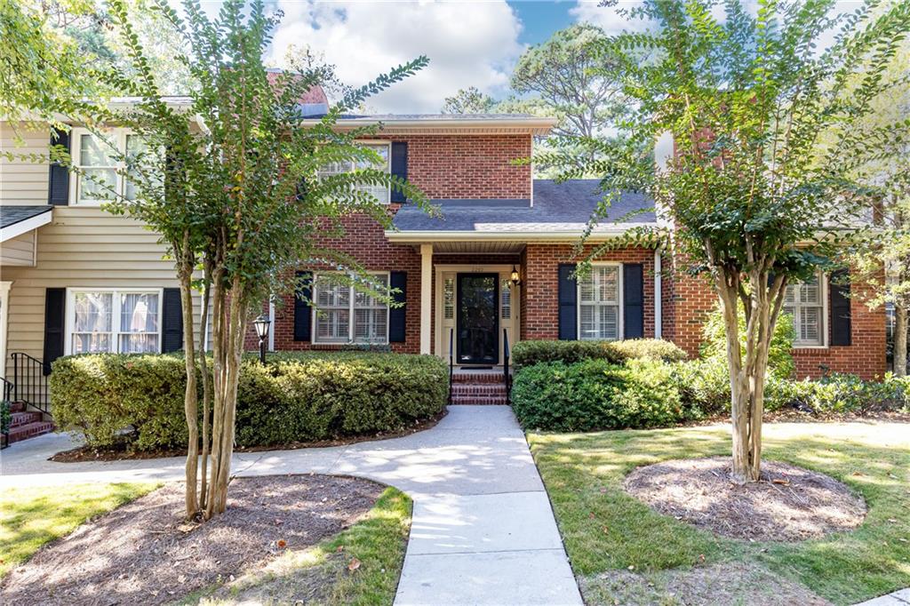 2210 Bohler Road Northwest Atlanta, GA 30327 - Photo 1 of 1 Lovely Glenridge Woods Townhome . . . loads of curb appeal!