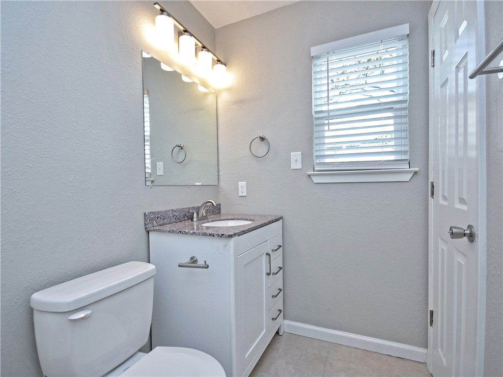 2302 Fuzz Fairway, Unit B Austin, TX 78728 - Photo 16 of 27 Primary Bathroom, new cabinets, tiled floor. Granite countertop.