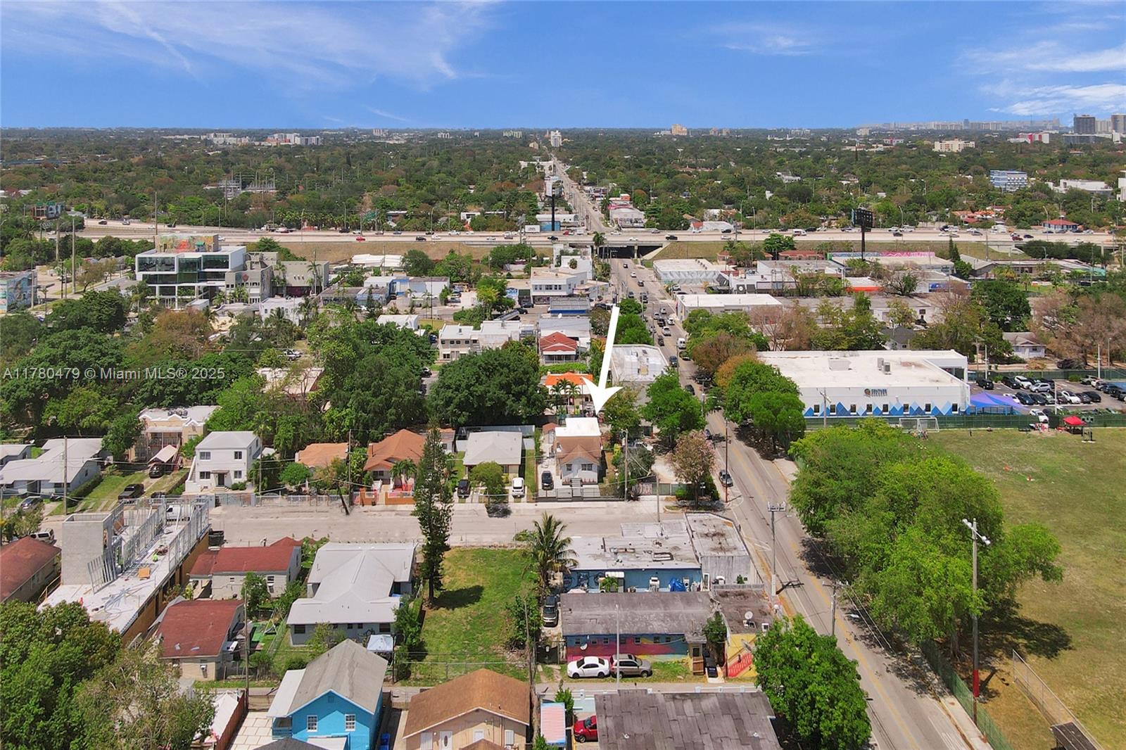 213 Northwest 34th Terrace Miami, FL 33127 - Photo 14 of 18 an aerial view of residential houses with outdoor space and trees