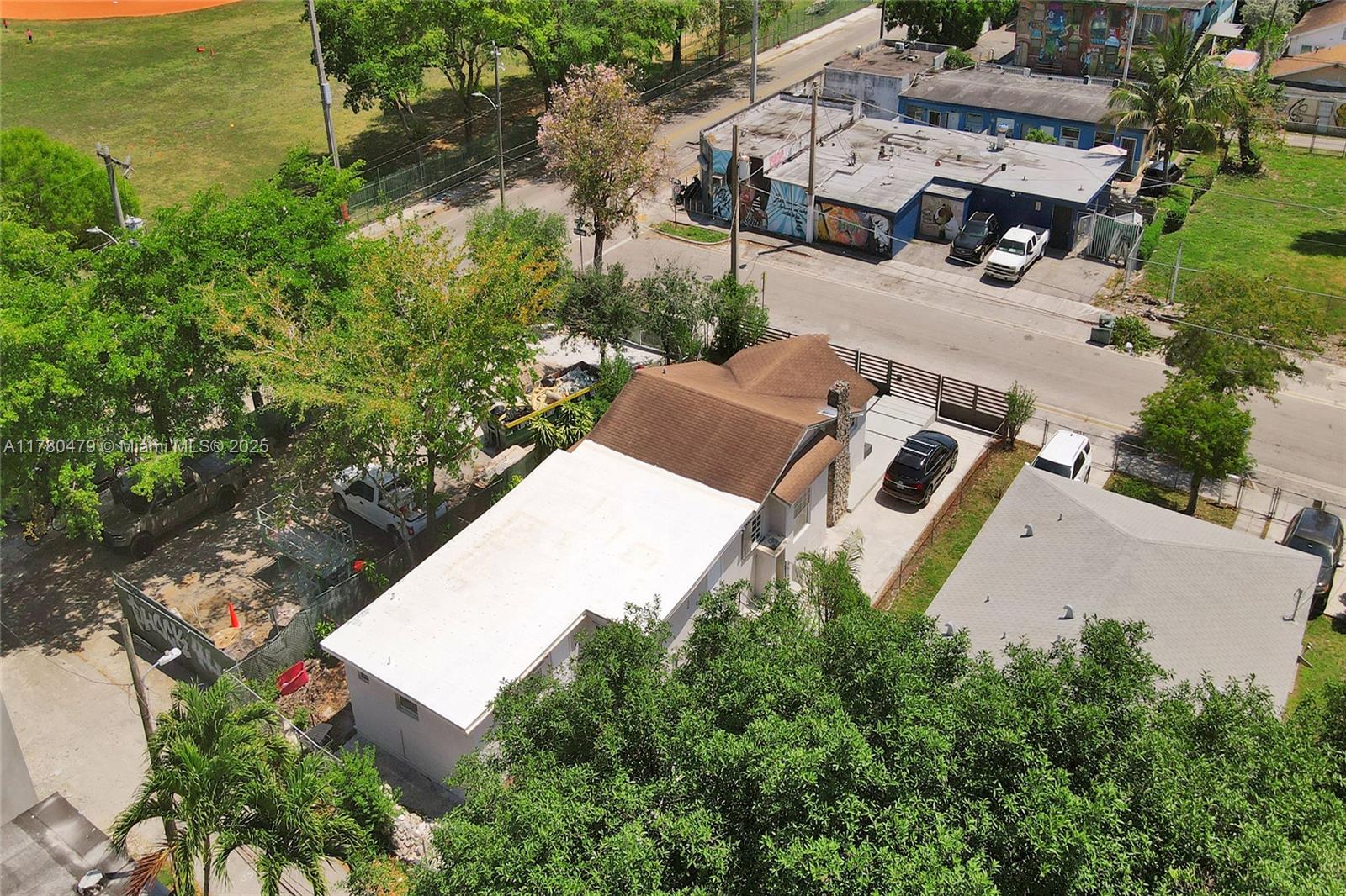 213 Northwest 34th Terrace Miami, FL 33127 - Photo 17 of 18 an aerial view of residential house with outdoor space and trees all around