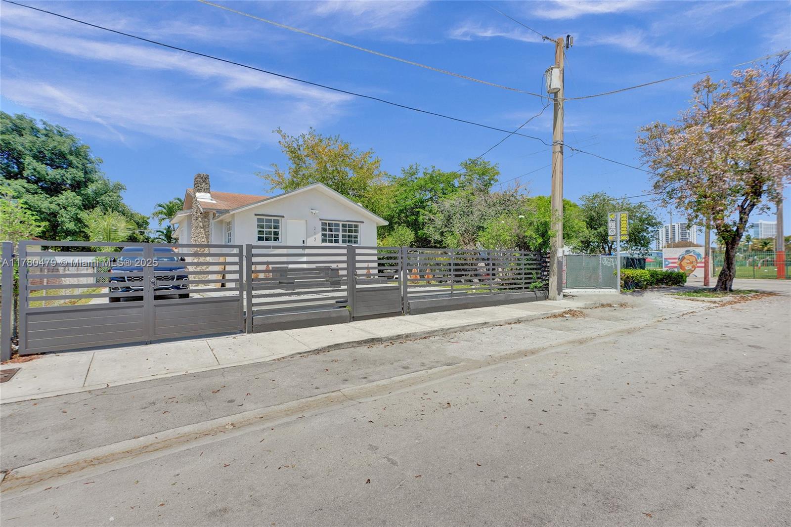 213 Northwest 34th Terrace Miami, FL 33127 - Photo 5 of 18 a front view of a house with a yard