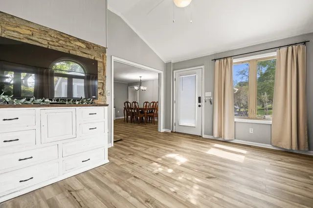 a view of a bathroom with mirror and a sink