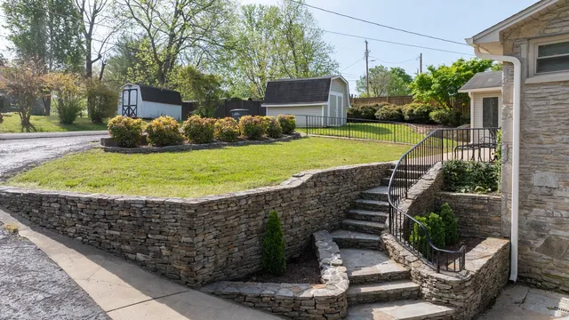a view of a garden with seating area