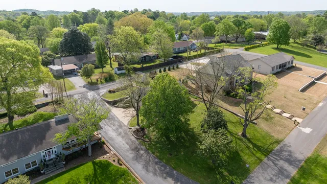 an aerial view of residential house with outdoor space and lake view