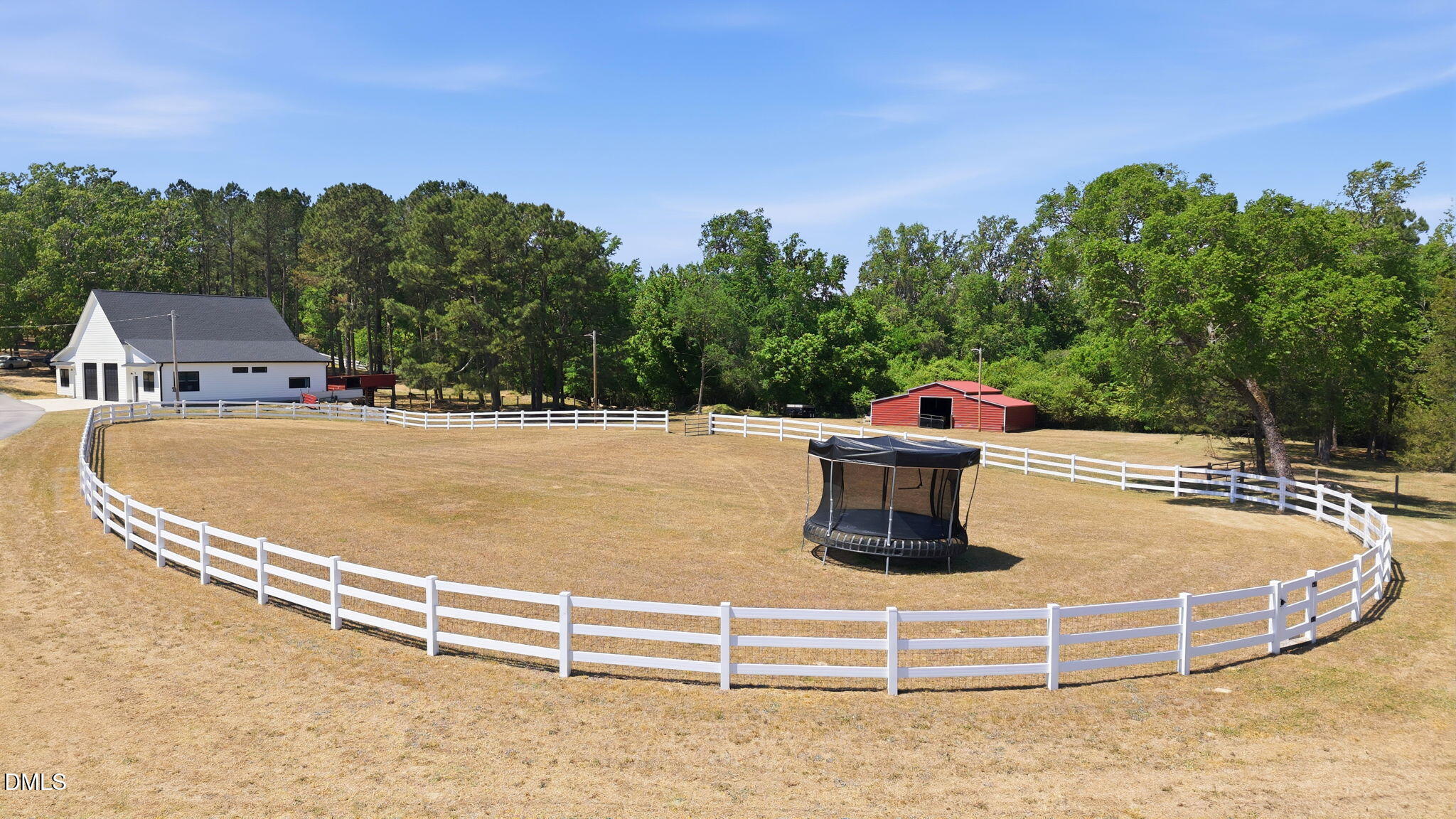 5416 Pulley Town Road Zebulon, NC 27597 - Photo 2 of 74 a view of a tennis ground with large trees