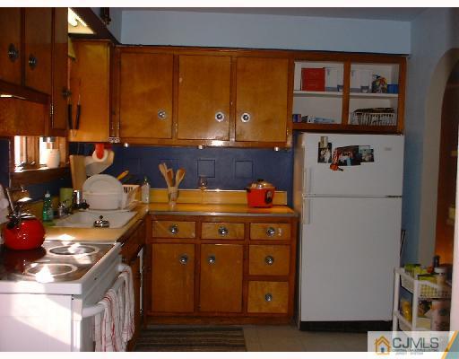 115 McFarlane Road Colonia, NJ 07067 - Photo 3 of 8 a kitchen with a sink and cabinets