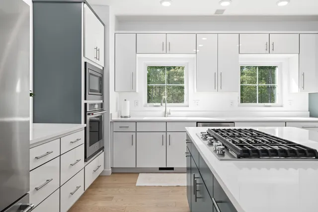a living room filled with furniture and a potted plant