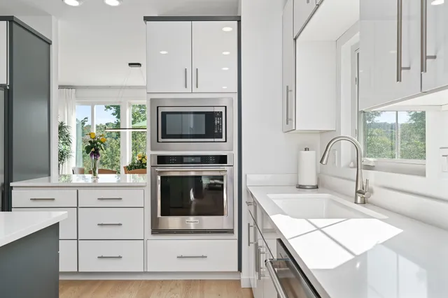a bathroom with a sink a mirror and a toilet
