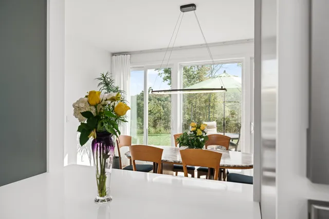 a kitchen with a refrigerator and a stove top oven