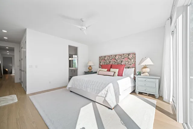 a bedroom with a bed and flat screen tv