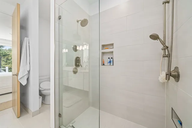 a view of a hallway with wooden floor and entryway