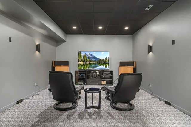 a view of a house with a big yard plants and large trees