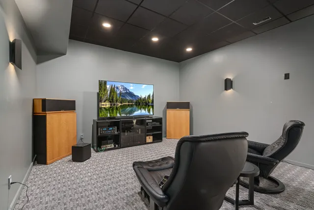 a view of a house with a big yard and a large tree