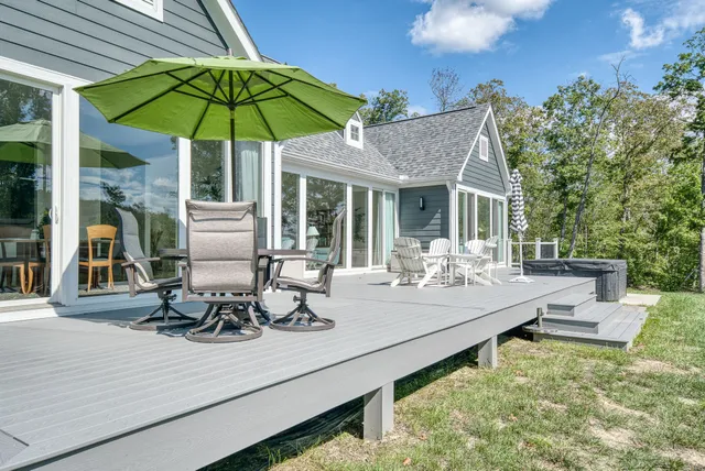 a view of a wooden house with a yard