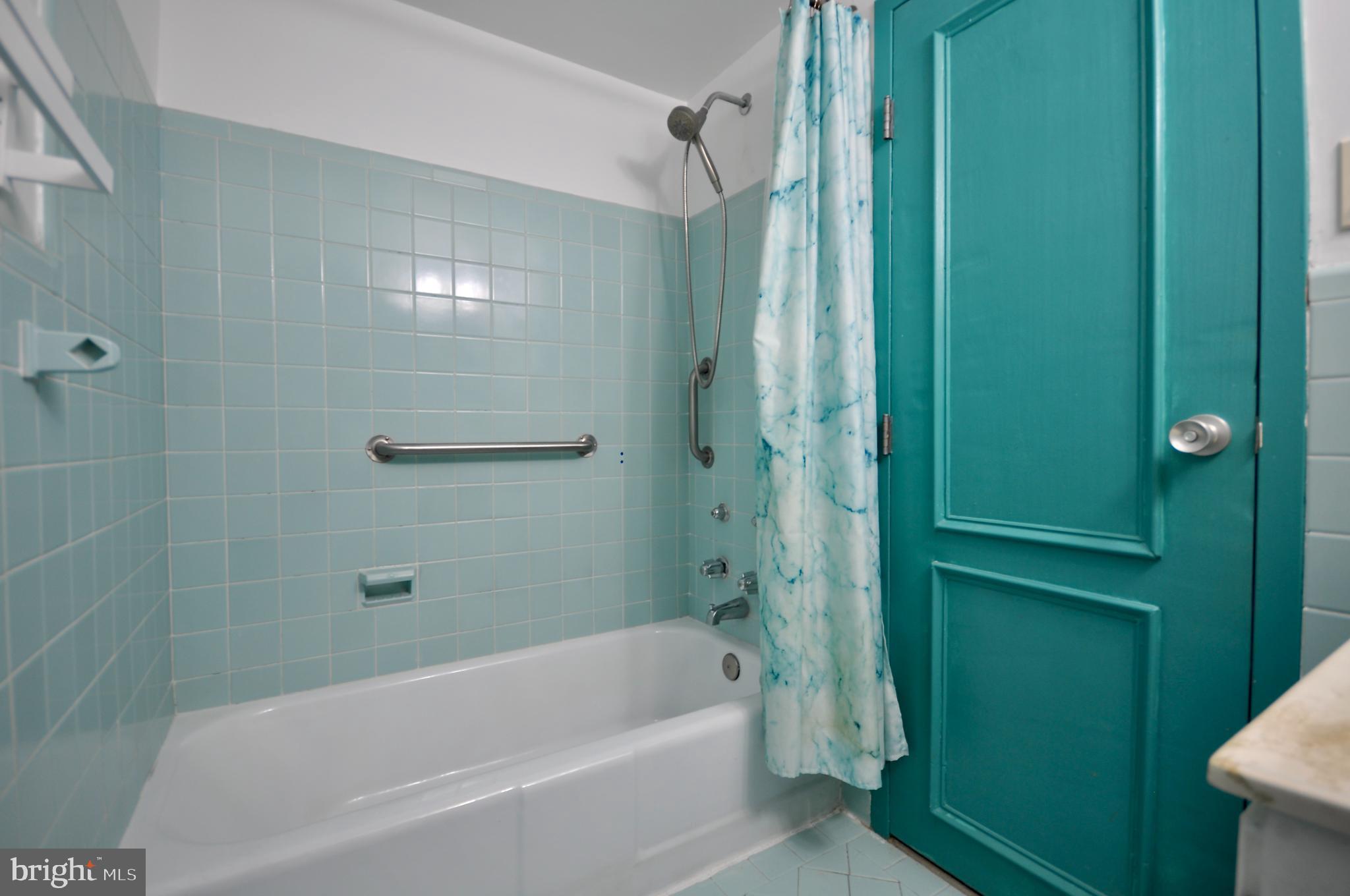 7900 Old York Road, Unit 608B Elkins Park, PA 19027 - Photo 11 of 19 a bathroom with a bathtub and a shower