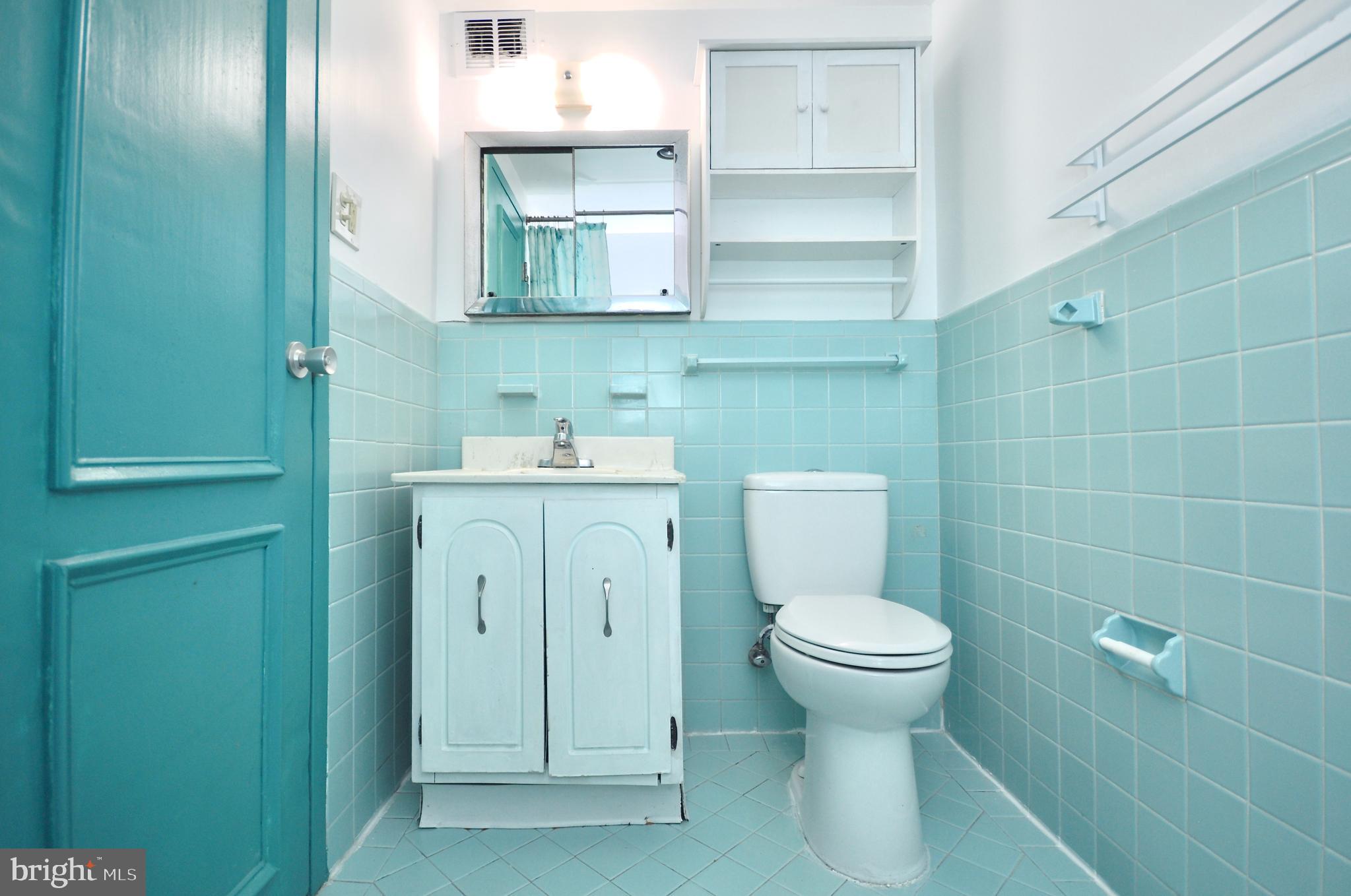 7900 Old York Road, Unit 608B Elkins Park, PA 19027 - Photo 8 of 19 a bathroom with a toilet sink and mirror