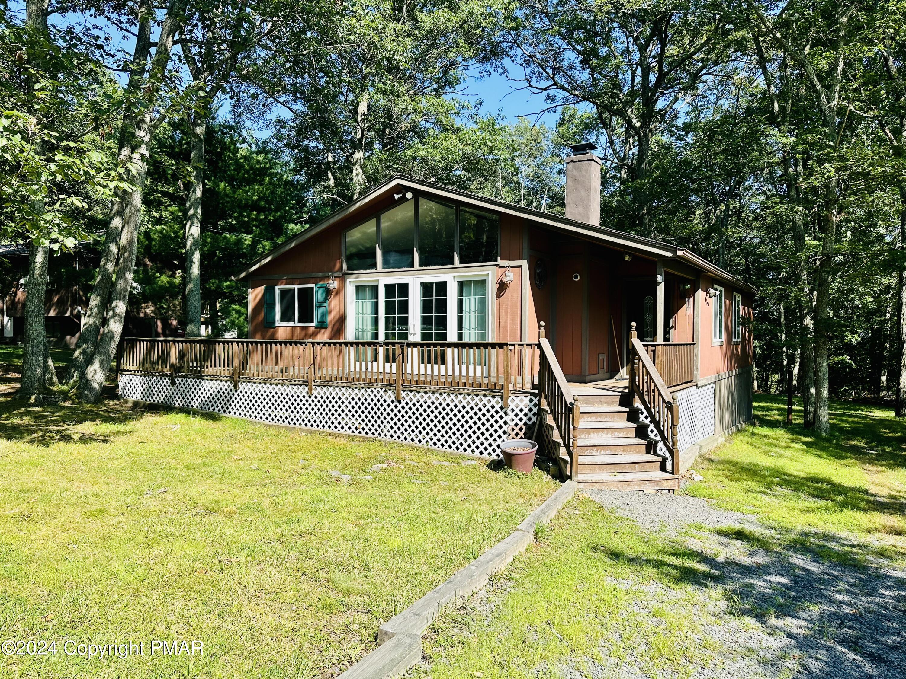 155 Sunrise Drive Milford, PA 18337 - Photo 2 of 16 a front view of house with yard and entertaining space