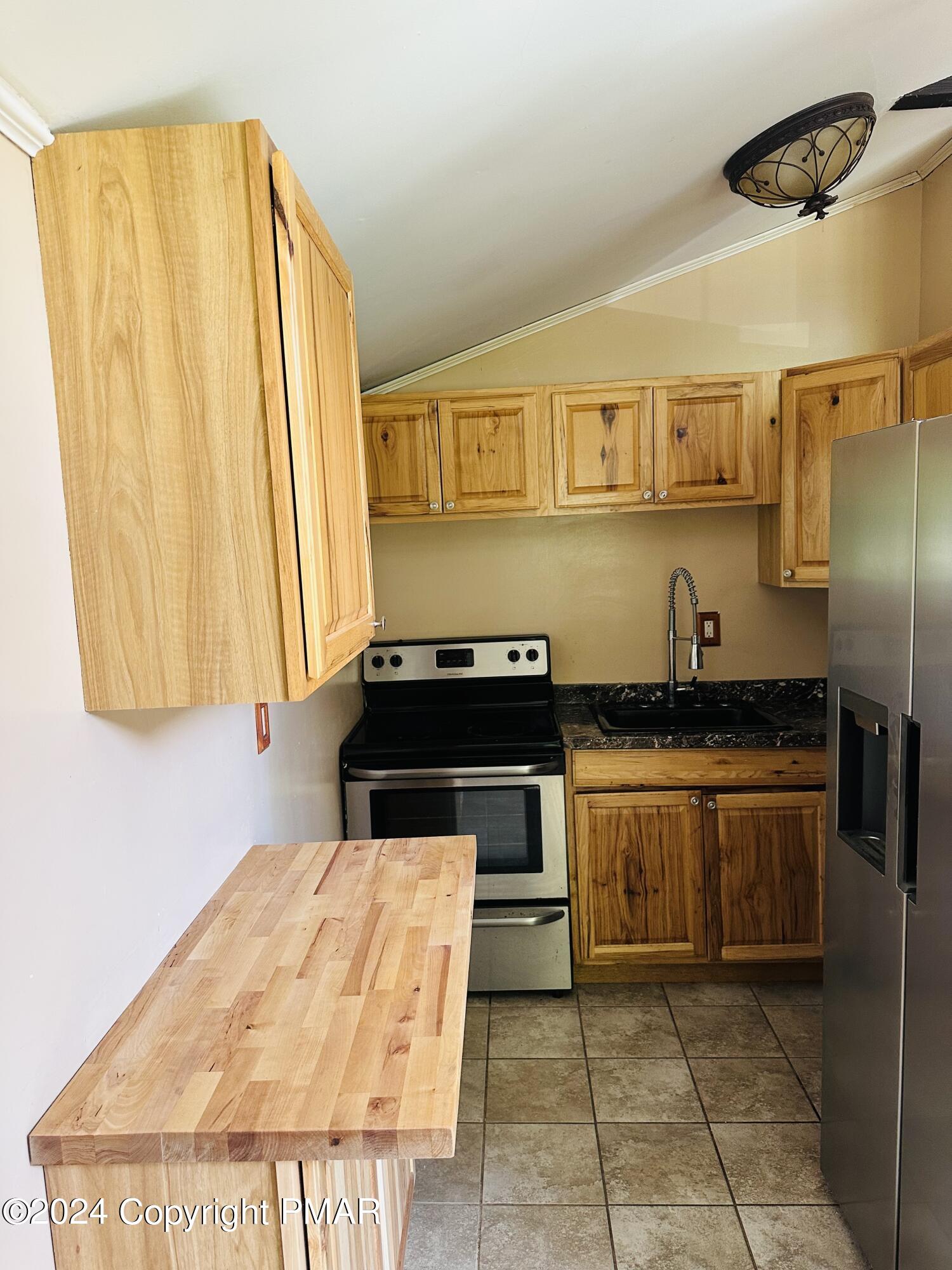 155 Sunrise Drive Milford, PA 18337 - Photo 4 of 16 a kitchen with a sink and a stove top oven