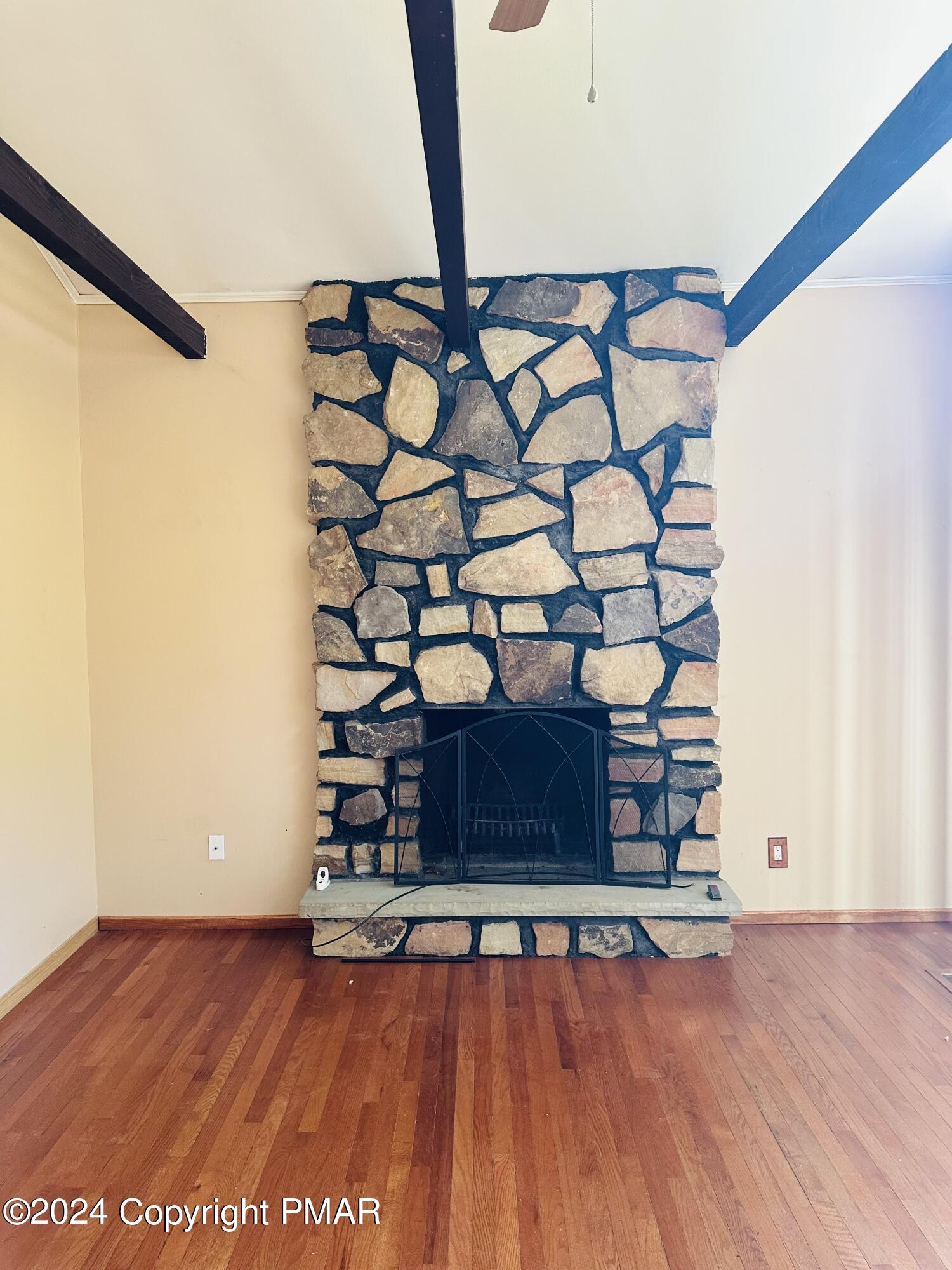 155 Sunrise Drive Milford, PA 18337 - Photo 8 of 16 a view of a room with wooden floor and white walls