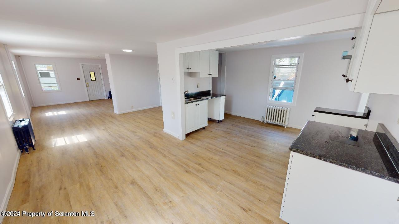 400 3rd Street Archbald, PA 18403 - Photo 1 of 15 a kitchen with granite countertop a sink and a stove top oven