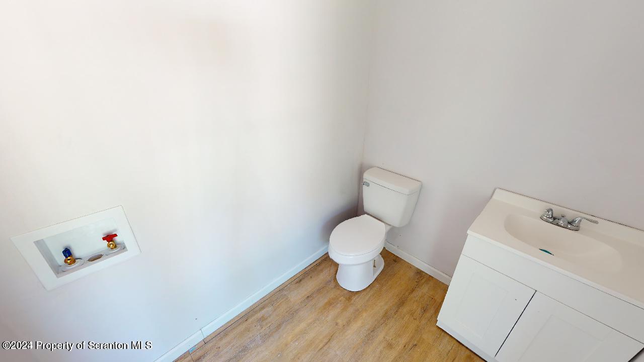 400 3rd Street Archbald, PA 18403 - Photo 3 of 15 a view of a room with wooden floor and sink