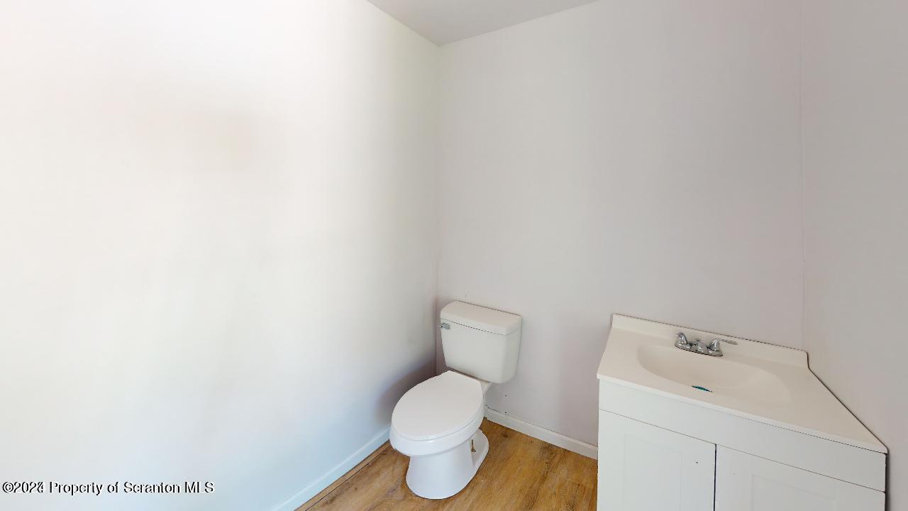 400 3rd Street Archbald, PA 18403 - Photo 8 of 15 a white toilet sitting next to a white cabinet