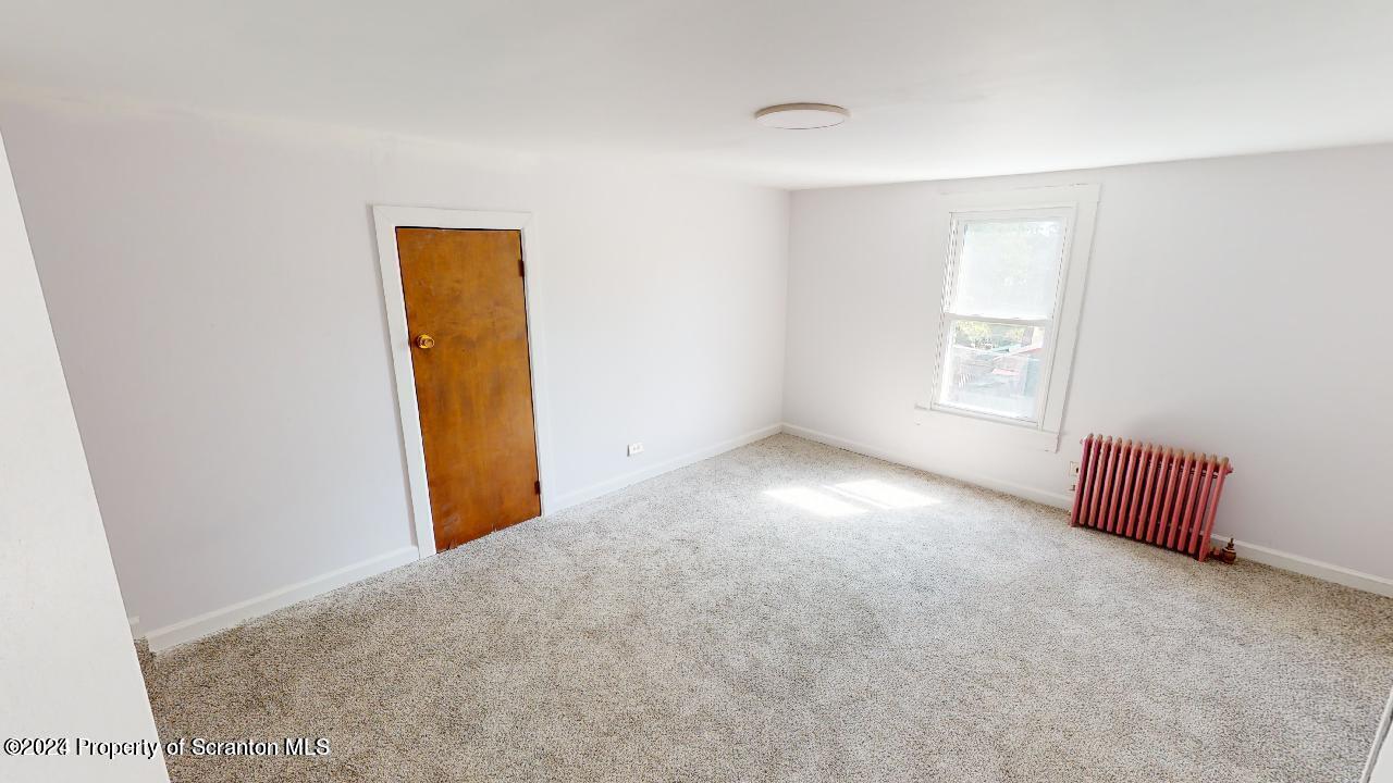 400 3rd Street Archbald, PA 18403 - Photo 10 of 15 a view of an empty room with a window