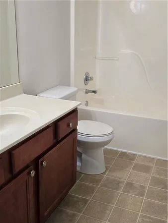 a bathroom with a sink a toilet and a bathtub