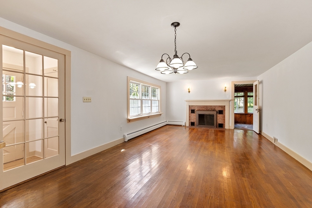 42 New Salem Road Petersham, MA 01366 - Photo 18 of 42 a view of a livingroom with wooden floor fireplace and window