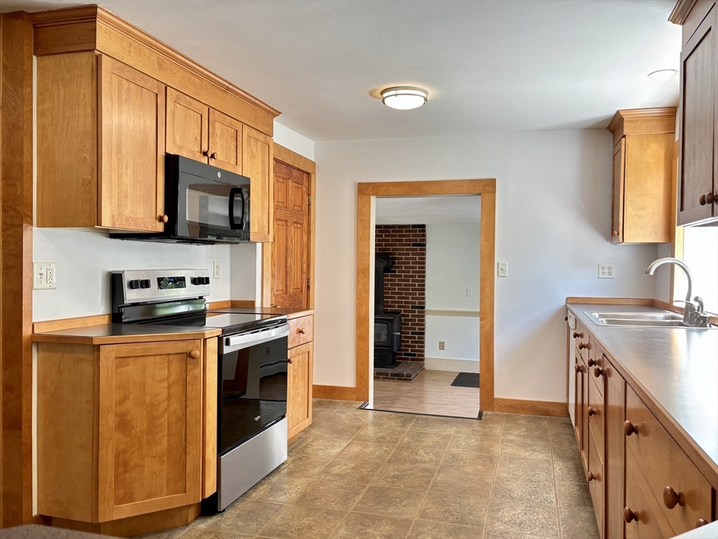 42 New Salem Road Petersham, MA 01366 - Photo 21 of 42 a kitchen with a sink stove and microwave