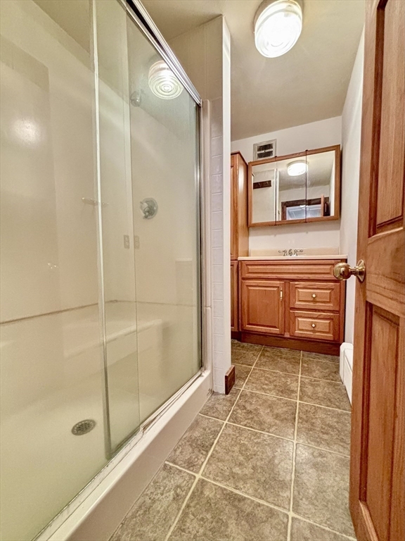 42 New Salem Road Petersham, MA 01366 - Photo 37 of 42 a bathroom with a shower and mirror