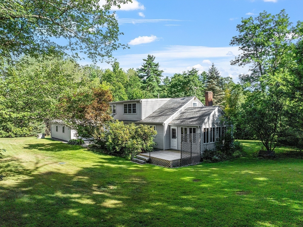 42 New Salem Road Petersham, MA 01366 - Photo 10 of 42 a view of a house with a big yard potted plants and large tree