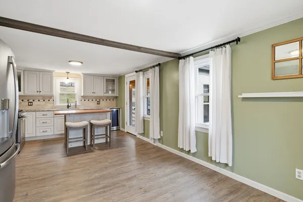 a kitchen with a table and chairs in it
