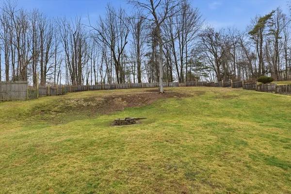 a swimming pool with trees in front of it