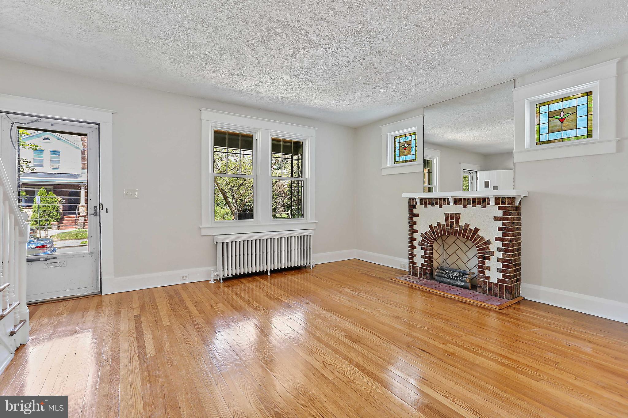 3023 Beverly Road Baltimore, MD 21214 - Photo 4 of 33 Living Room with electric faux fireplace