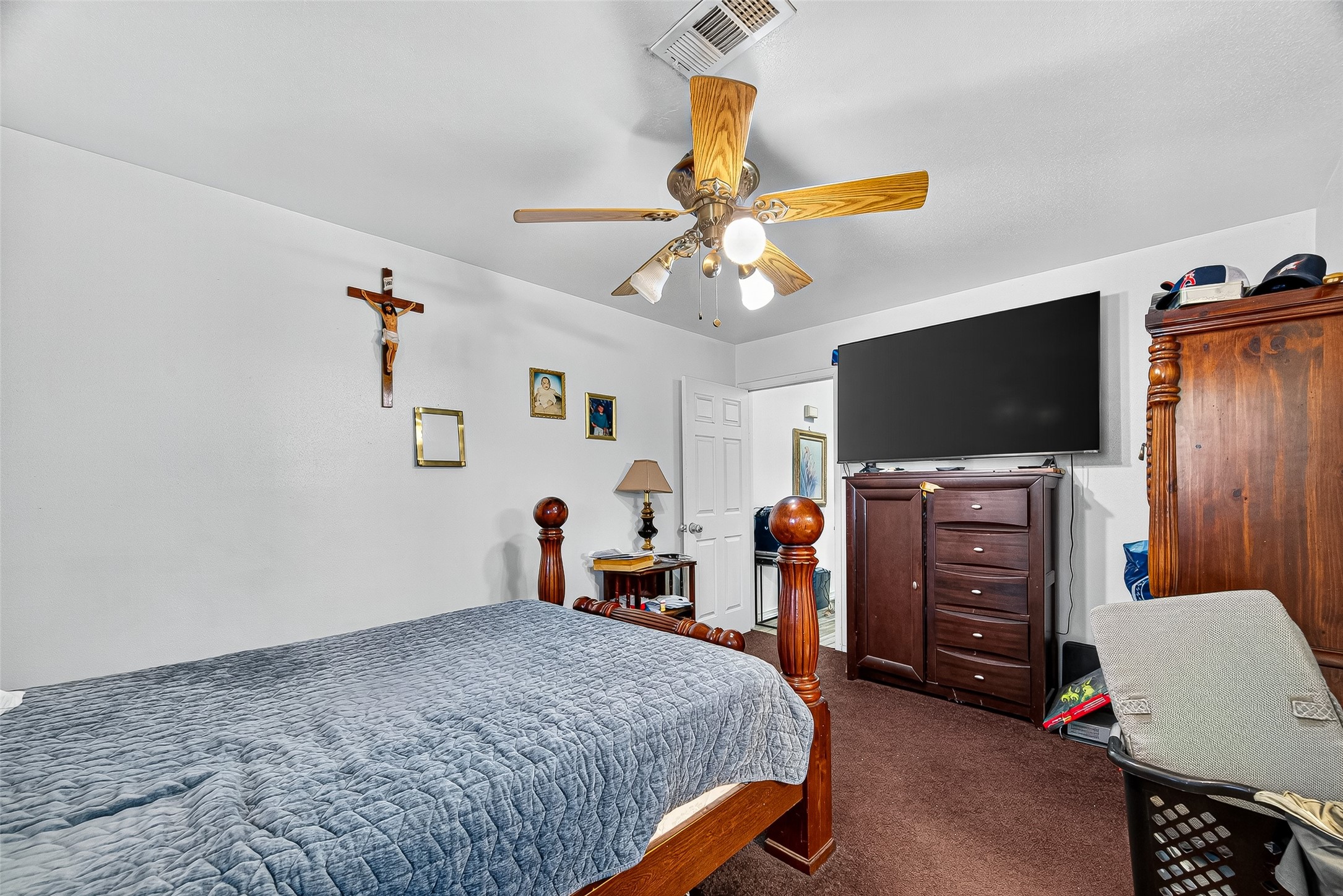 8222 La Roche Lane Houston, TX 77036 - Photo 13 of 32 a bedroom with a bed and a flat screen tv