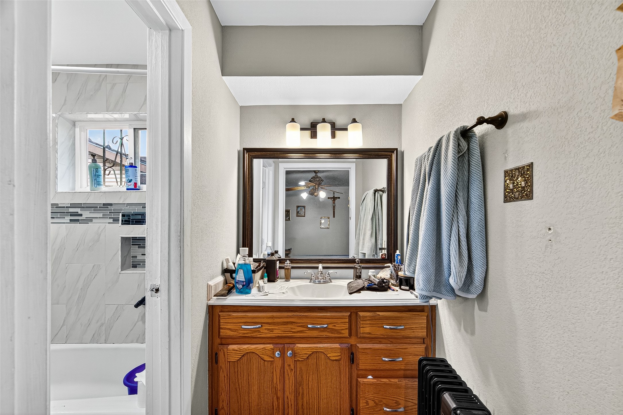 8222 La Roche Lane Houston, TX 77036 - Photo 14 of 32 a bathroom with a granite countertop sink vanity and a mirror