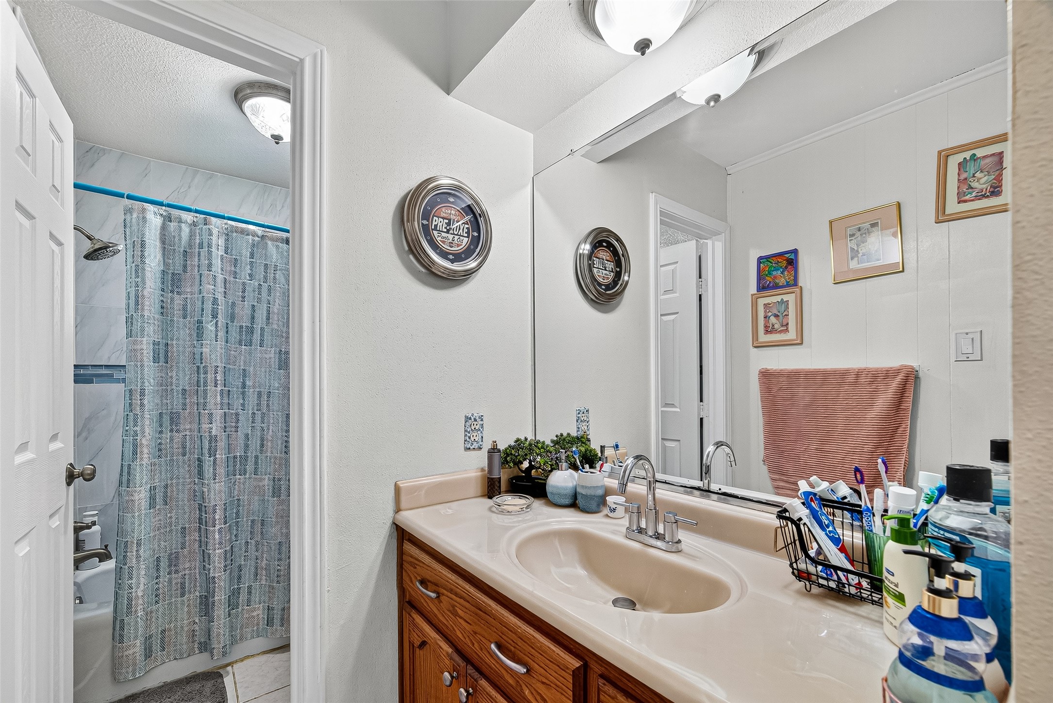 8222 La Roche Lane Houston, TX 77036 - Photo 16 of 32 a bathroom with a sink and a mirror