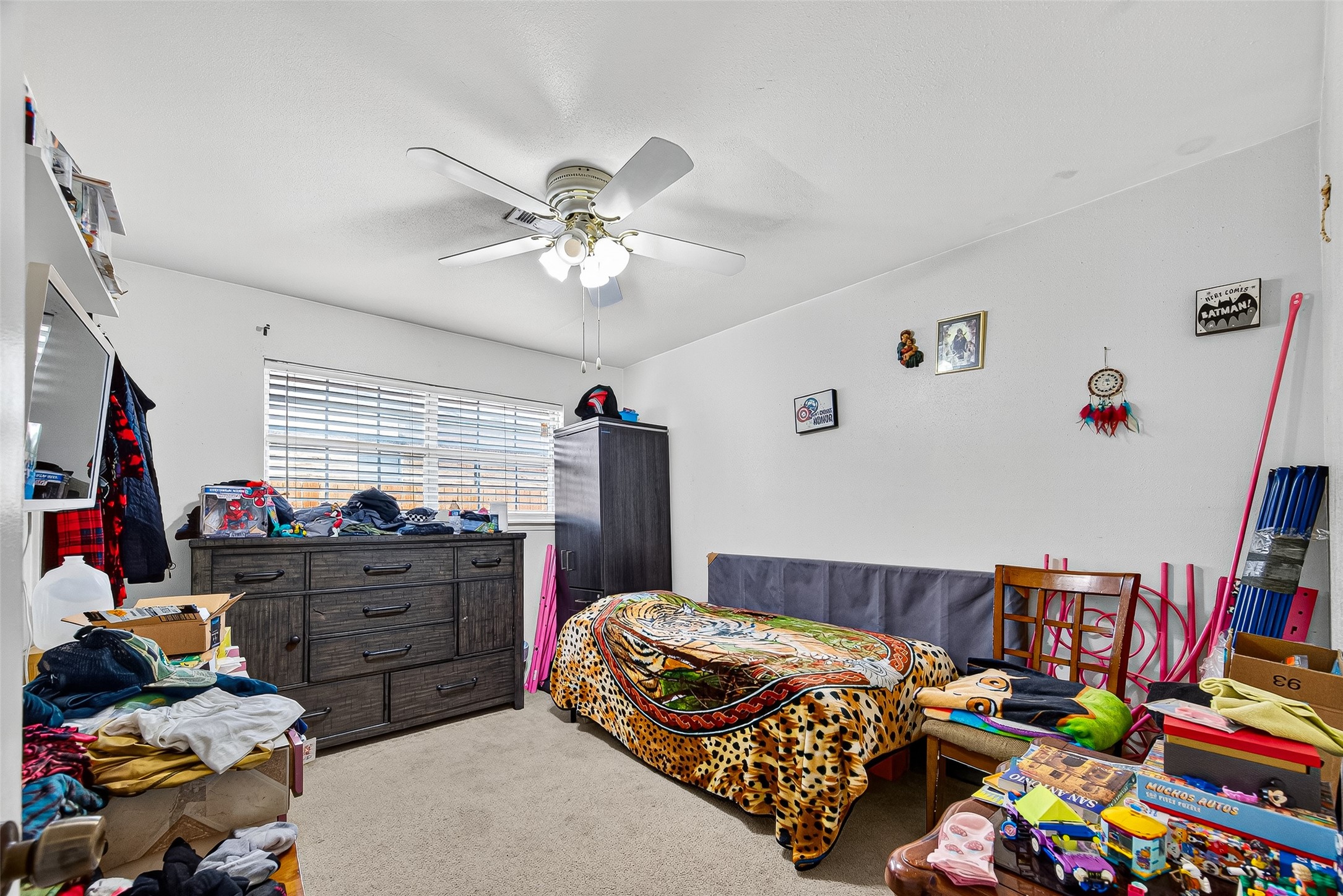 8222 La Roche Lane Houston, TX 77036 - Photo 18 of 32 a bedroom with bed and a window