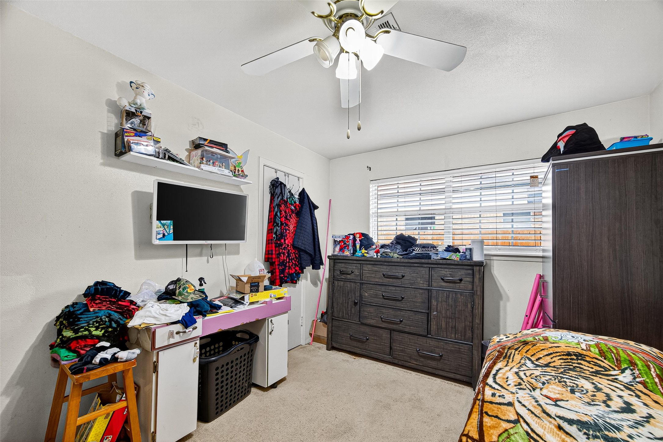 8222 La Roche Lane Houston, TX 77036 - Photo 19 of 32 a bed room with a bed and a flat screen tv